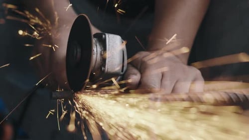 Sparks Fly as Metal Rod is Cut