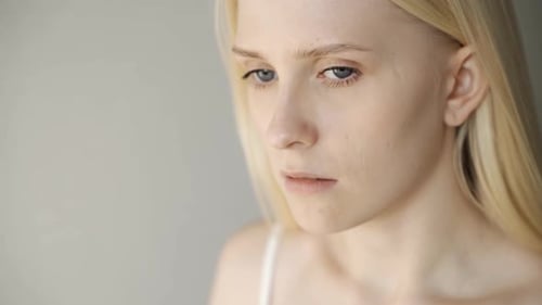 Woman Takes Pill and Drinks Water