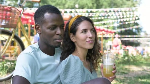 Affectionate Couple Laughing Together in a Park