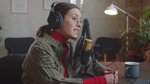 Female Blogger Recording Podcast in Studio