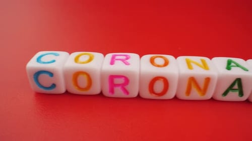 Cubes Spell Coronavirus on Red Background