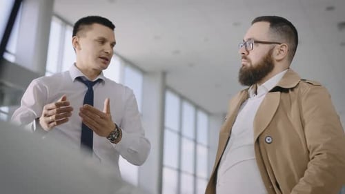 Sales Manager and Client Near a New Car with an Open Hood