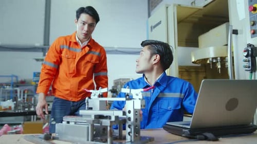 Male Asian engineer professional having a discussion