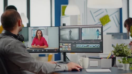 Video Editor Working on Project in Modern Office