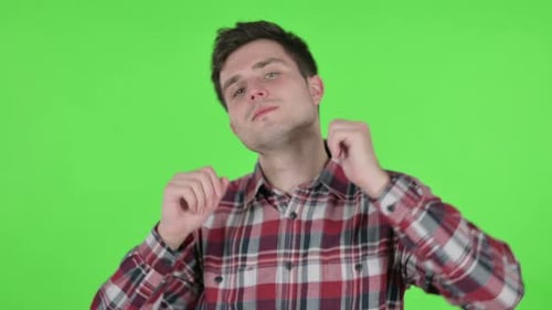 Portrait of Young Man Dancing in Joy Green Chroma Screen