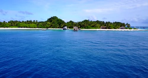 Wide angle above copy space shot of a paradise sunny white sand beach and aqua blue water background