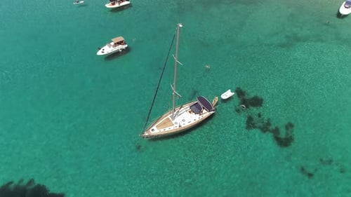Aerial view above group of boats anchored in the mediterranean sea, Greece.
