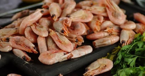 Delicious Boiled Shrimp on a Cutting Board Rotate.