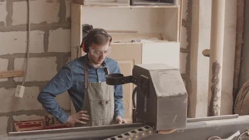 Carpenter Operating CNC Machine