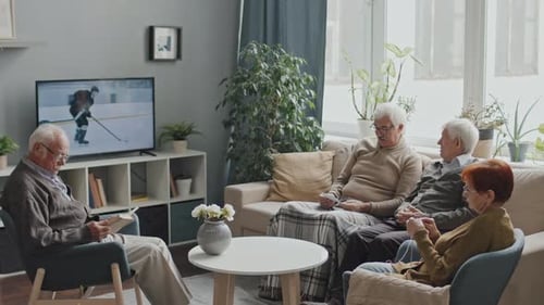Seniors Resting by TV at Nursing Home