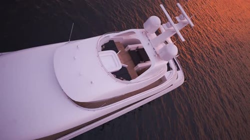 Big, luxury yacht sailing in the open sea during beautiful pink sunset. 4K HD