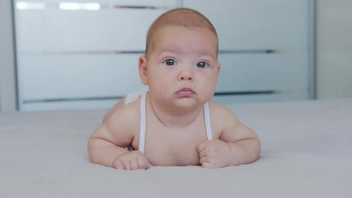 Cute Baby Lying on Stomach Close Up