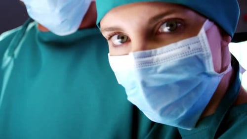 Portrait of female surgeon standing in a operating room