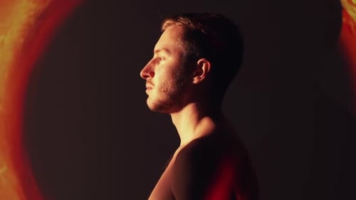 Shirtless Man with Dramatic Orange Lighting