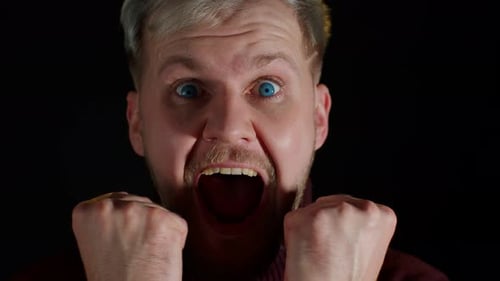 Man Yelling in Shock and Celebration