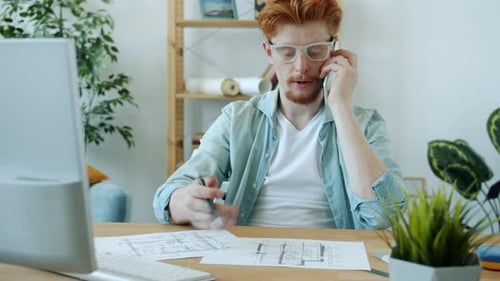 Young Adult Architect Works from Home Office