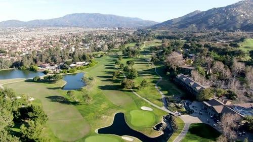 Aerial View of Golf Course with Green Field in the Valley.