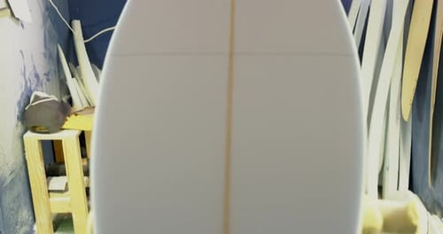 Man making surfboard