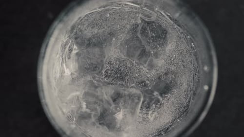 Ice Cubes in Bubbling Glass Beverage Close-up