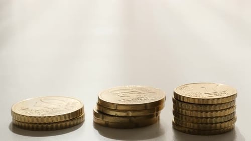 Stacks of Euro Coins on White Background