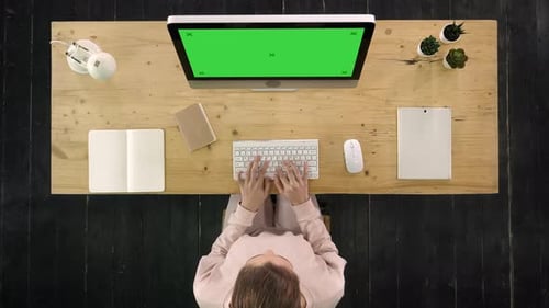Beautiful Woman In Casual Outfit Typing On The Computer. Green Screen Mock-up Display