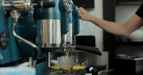 Close Up Young Caucasian Female Barista Worker Preparing Coffee Drink Near Coffe Machine Serving Hot