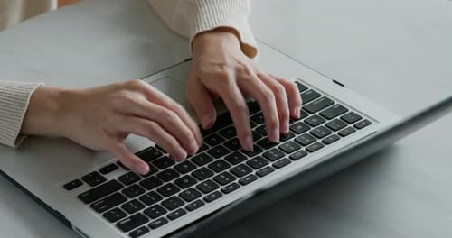 Woman type on laptop computer