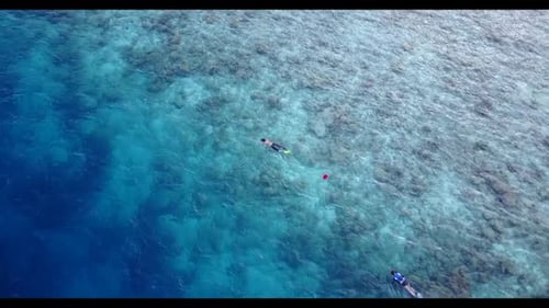 Young couple suntan on relaxing sea view beach time by blue ocean with white sandy background of the