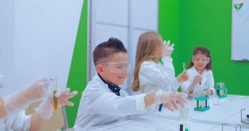 Enthusiastic Children Conduct Science Experiment in Lab