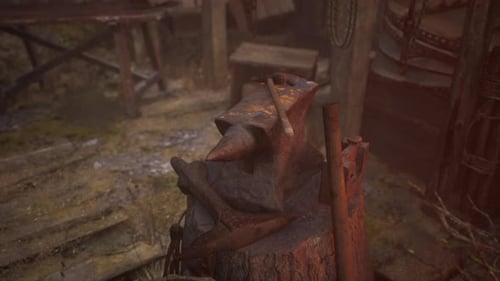 Blacksmiths Tools Hammer and Anvil in Old Blacksmiths Workshop
