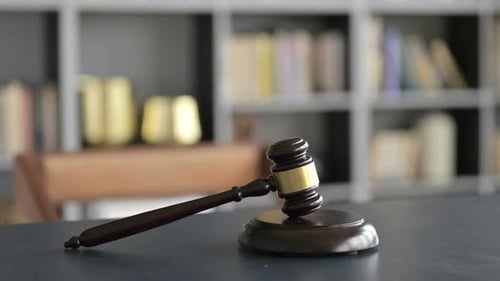 Close Up of Gavel on Lawyer Court Room Table