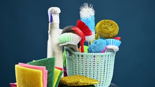 Cleaning Supplies in a Basket With Spray Bottle