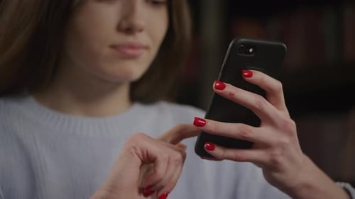 Close Up of an Unrecognizable Woman Browsing on Her Smart Phone Swipe and Scroll