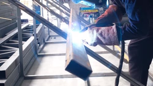 Welder joins metal with bright sparks