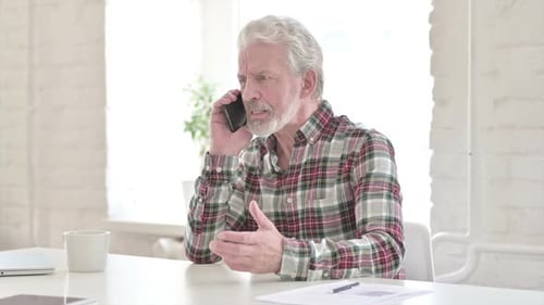Angry Casual Old Man Talking on Smartphone