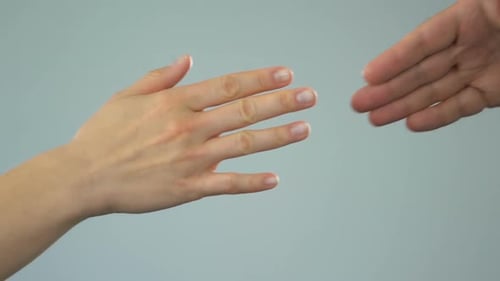Hands Clasping Together in a Close Up Shot