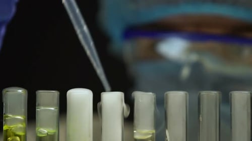 Scientist Working with Test Tubes in Laboratory