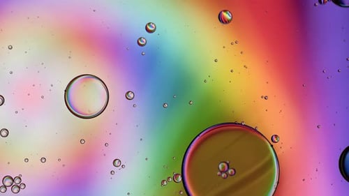 Abstract Liquid and Oil Droplets with Rainbow Background