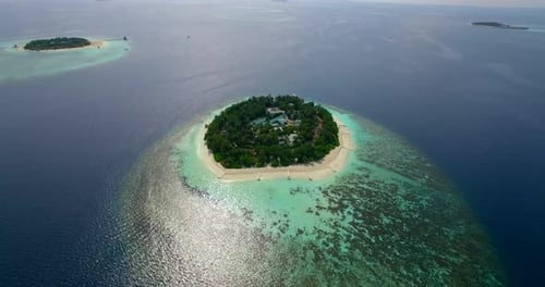 Aerial drone view of scenic tropical islands in the Maldives.