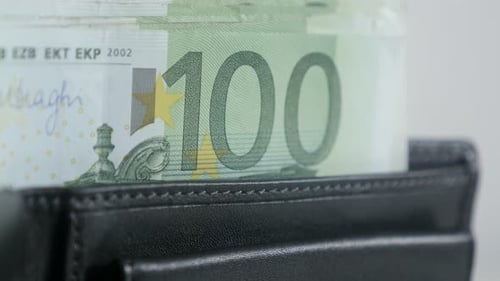 Tilting on black wallet full of green banknotes 3840X2160 UltraHD footage - Euro paper money in bi