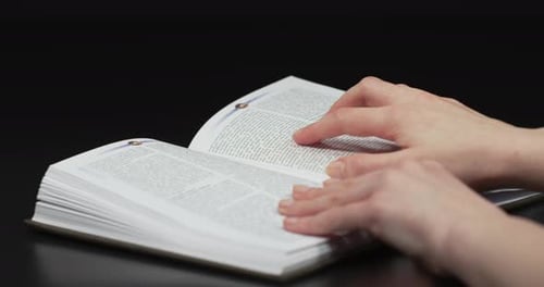 Hands Reading Dictionary Close Up