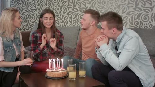 Friends Celebrate Birthday with Cake and Toast
