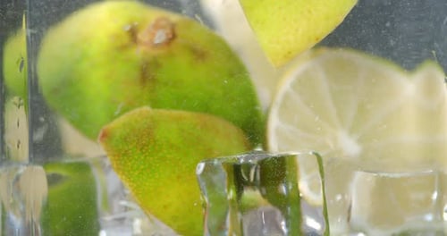 The Slices of Fresh Lime with Ice Cubes.