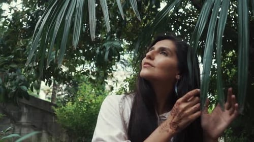 Woman Posing with Henna in Green Nature Setting