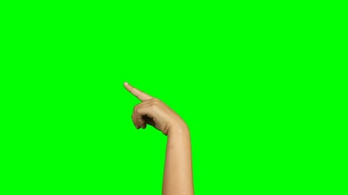 Person making hand gesture against green screen background