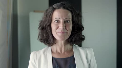 Business Woman Smiling in Professional Setting