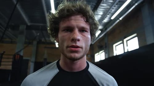 Exhausted Fighter Sweating in Sport Club. Kickboxer Breathing Hard at Gym