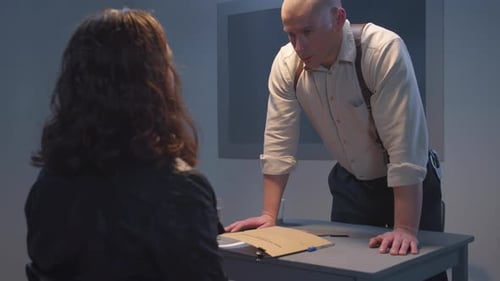 Serious Police Interrogation with Woman and Man in Room