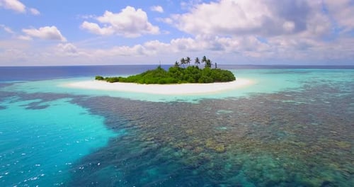 Aerial drone view of a scenic tropical island in the Maldives.