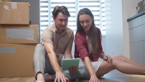 Young Couple Moving into New Home Together